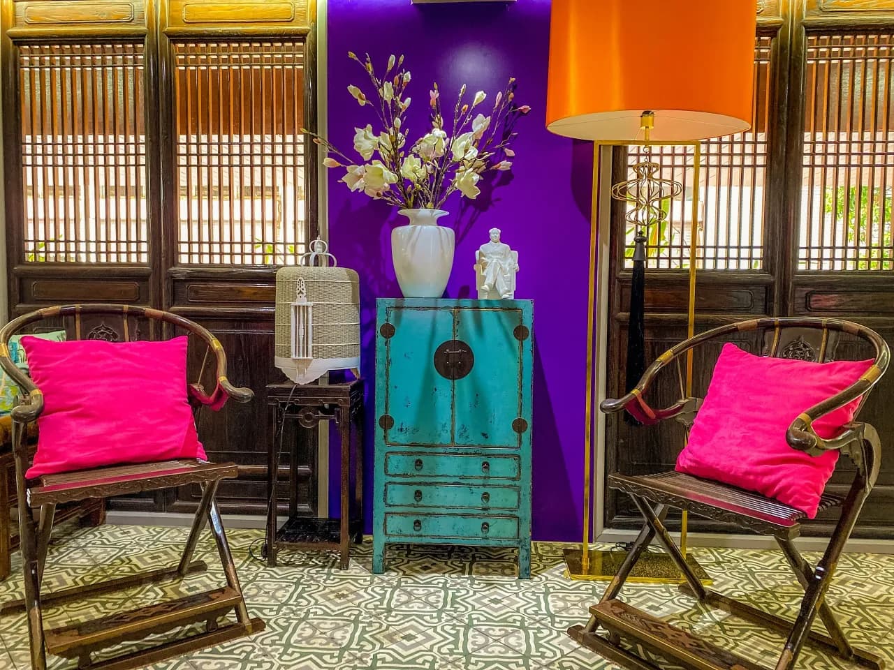 Sino House Phuket lobby with Sino style decor and pink cushions